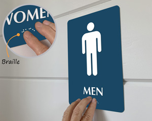 Restoom sign with braille
