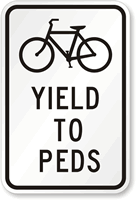 Bicycles Yield To Peds Traffic Sign